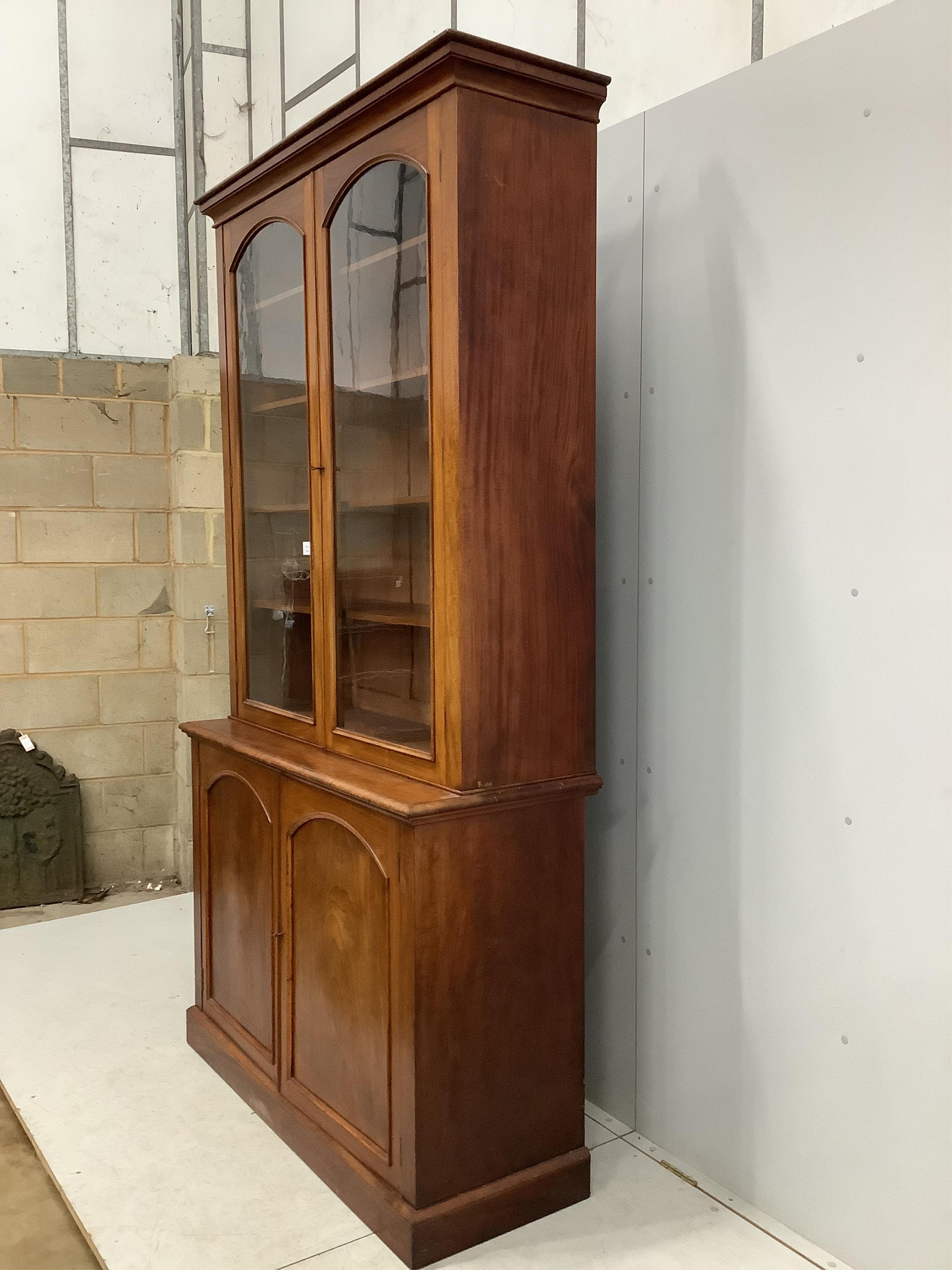 A Victorian mahogany library bookcase, width 127cm, depth 49cm, height 236cm. Condition - fair